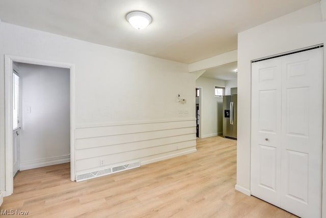 empty room with light wood-type flooring