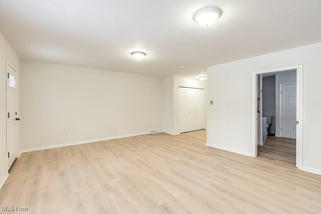 unfurnished room with light hardwood / wood-style flooring