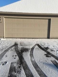 view of snow covered garage