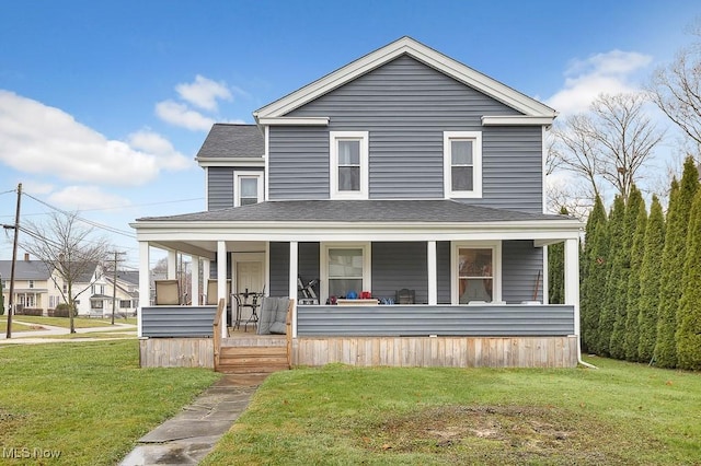 view of front of property featuring a porch and a front lawn