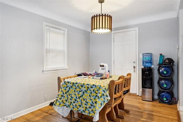 dining space featuring wood-type flooring