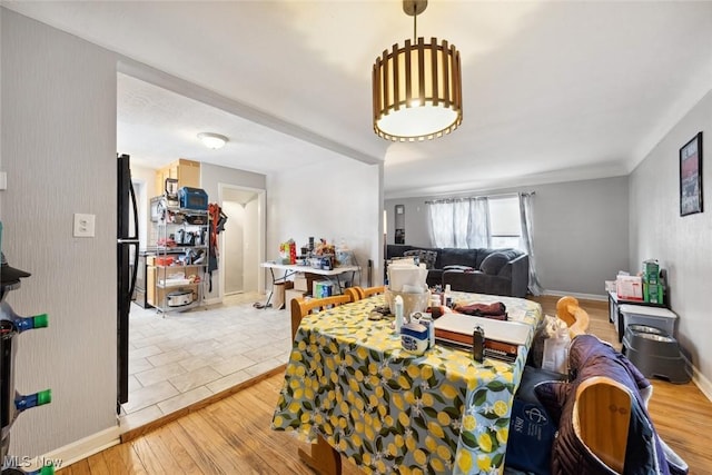 dining space with hardwood / wood-style floors