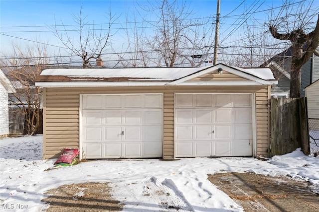 view of snow covered garage