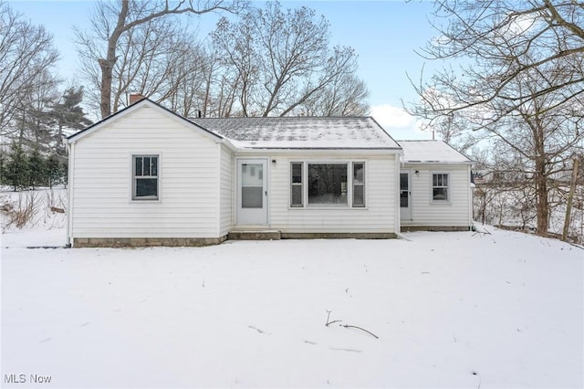 view of snow covered house