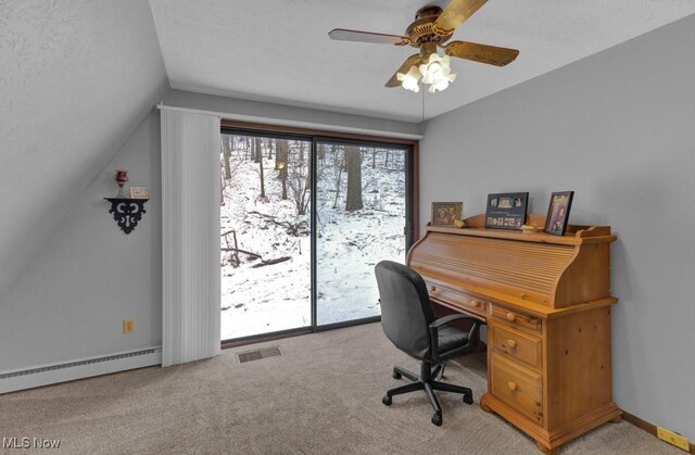 carpeted home office featuring ceiling fan, vaulted ceiling, and a baseboard radiator