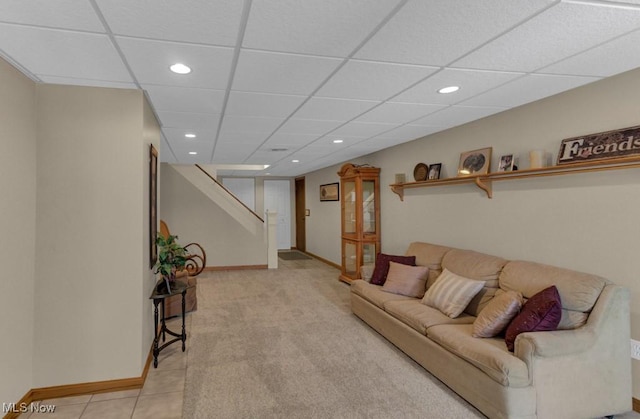 living room featuring a paneled ceiling