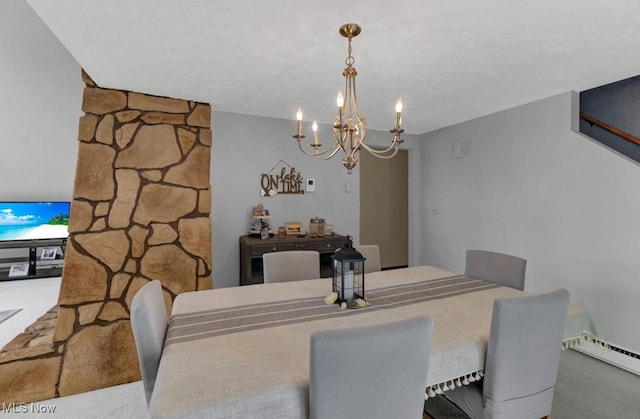 dining room with carpet floors, a notable chandelier, and a baseboard radiator