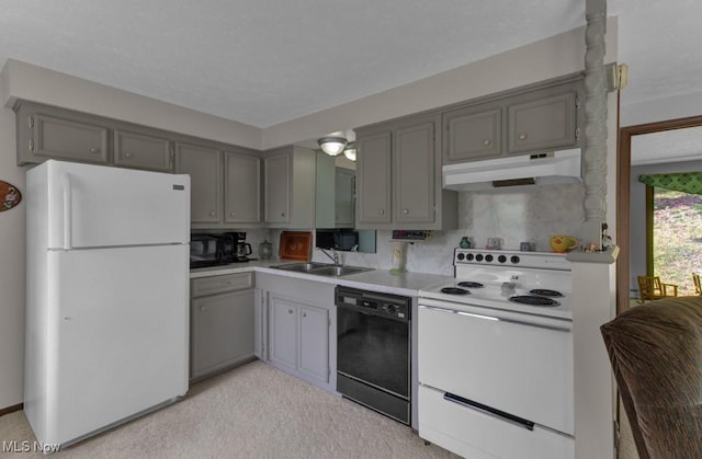 kitchen featuring sink, black appliances, and gray cabinetry