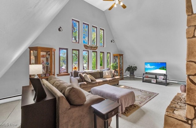 living room featuring a towering ceiling, carpet floors, ceiling fan, and baseboard heating