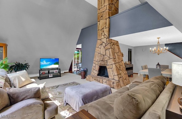 living room with carpet flooring, lofted ceiling, a chandelier, and a fireplace