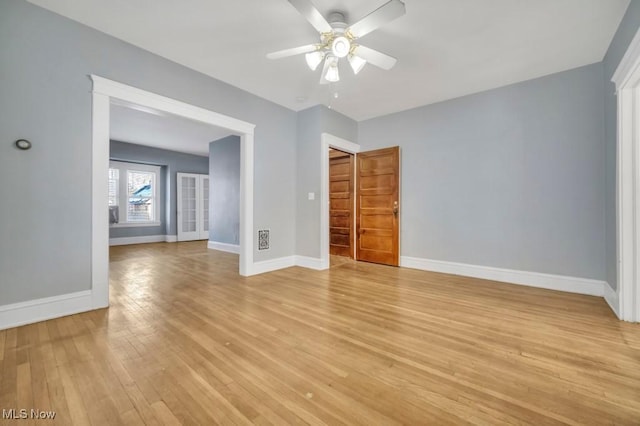 unfurnished room with ceiling fan and light hardwood / wood-style floors