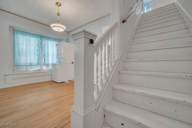 staircase featuring hardwood / wood-style flooring