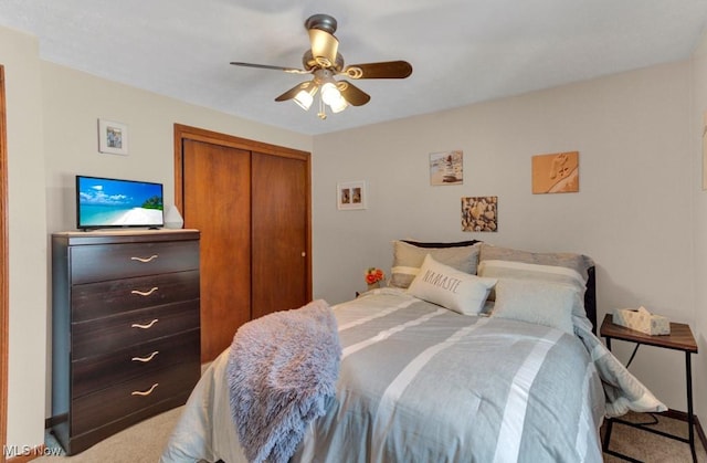 bedroom featuring ceiling fan and a closet