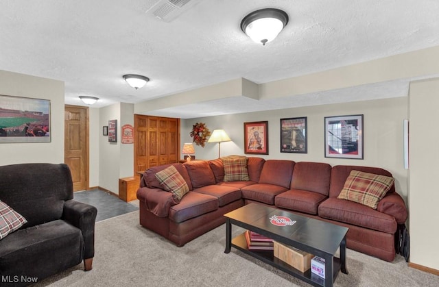 living room featuring light colored carpet and a textured ceiling