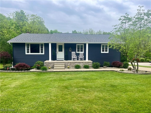 single story home featuring covered porch and a front lawn