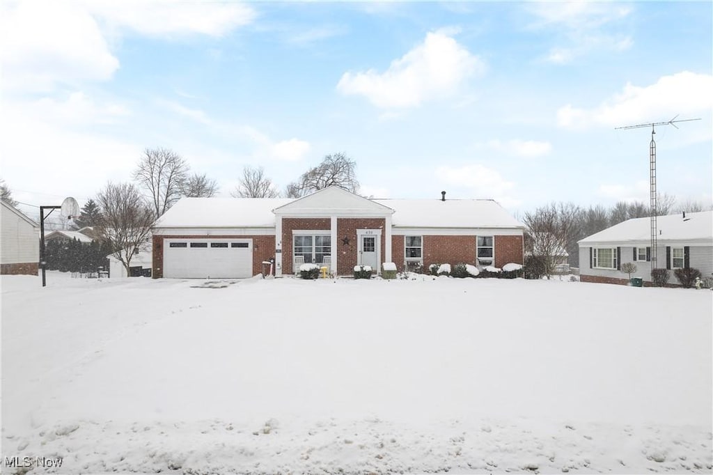 single story home featuring a garage