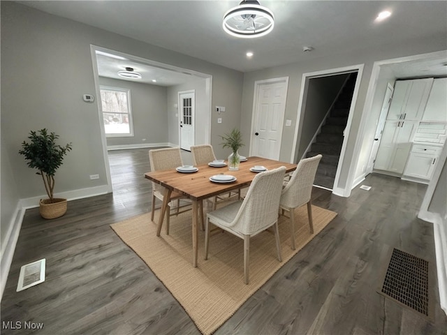 dining room with dark hardwood / wood-style floors