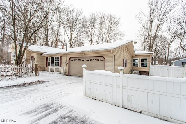 single story home with a garage