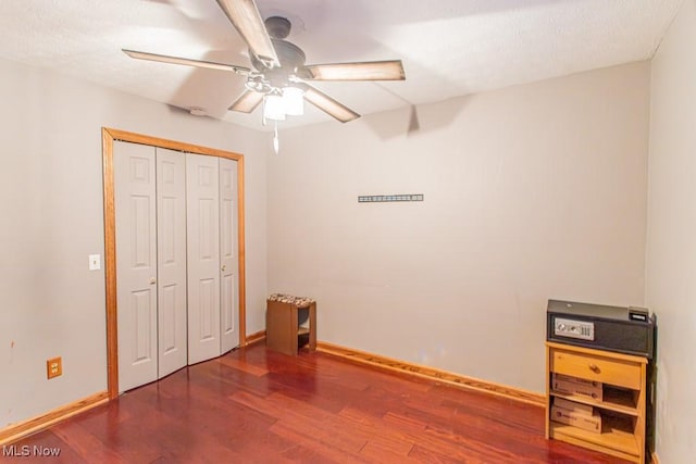 bedroom featuring ceiling fan, a closet, and hardwood / wood-style floors