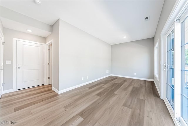 empty room with light wood-type flooring