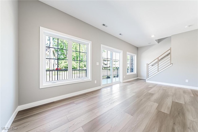 unfurnished living room featuring light hardwood / wood-style floors