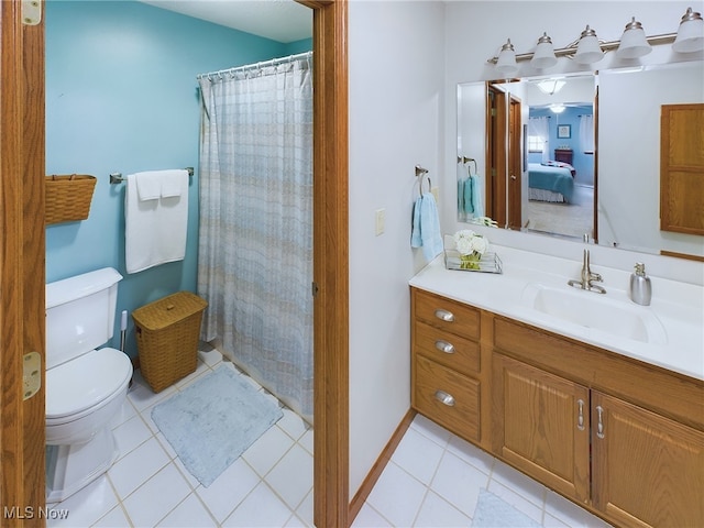 bathroom featuring toilet, curtained shower, tile patterned floors, and vanity