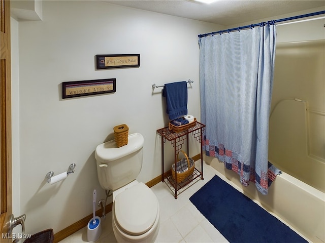 bathroom with toilet and shower / bath combo