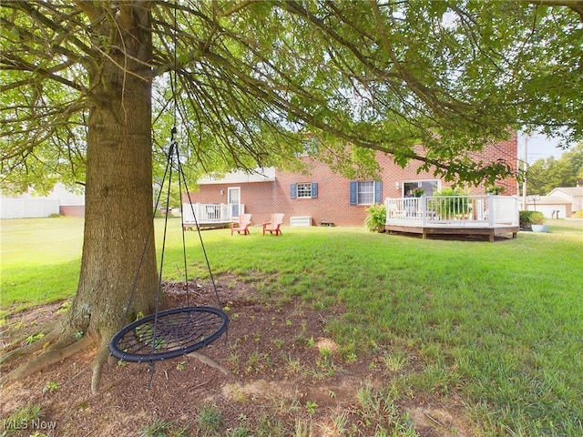 view of yard with a wooden deck