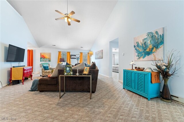 carpeted living room with high vaulted ceiling and ceiling fan