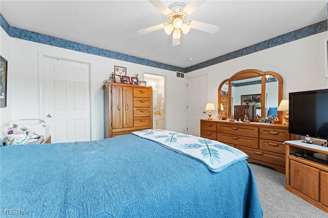 bedroom featuring light carpet and ceiling fan