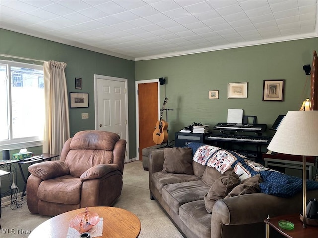 living room with light carpet and ornamental molding