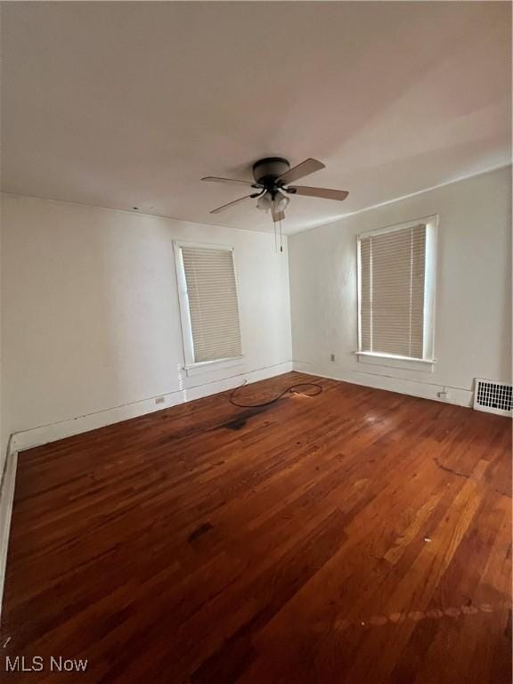 spare room featuring ceiling fan and hardwood / wood-style floors