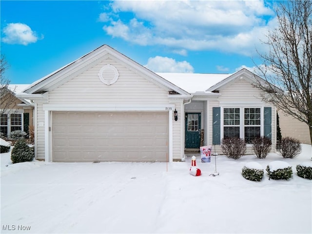 ranch-style house featuring a garage