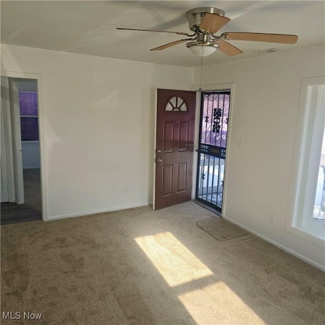 interior space featuring ceiling fan