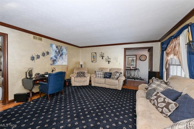 living room with a textured ceiling and ornamental molding