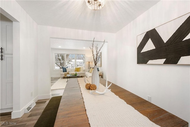 dining space featuring wood-type flooring