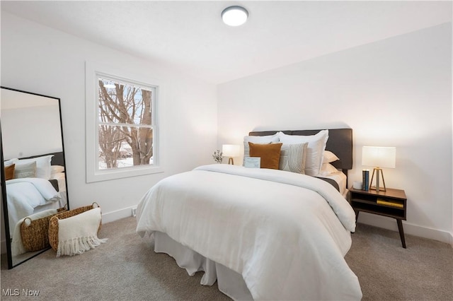 bedroom with light colored carpet