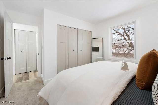 bedroom featuring a closet and light hardwood / wood-style flooring