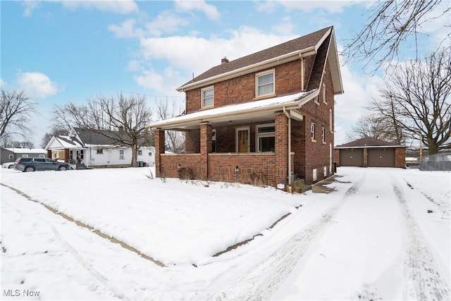 view of front of house with covered porch and a garage