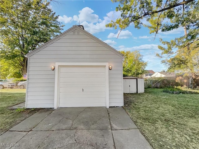 garage featuring a yard