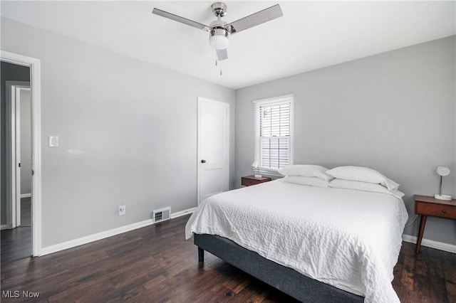 bedroom with ceiling fan and dark hardwood / wood-style flooring