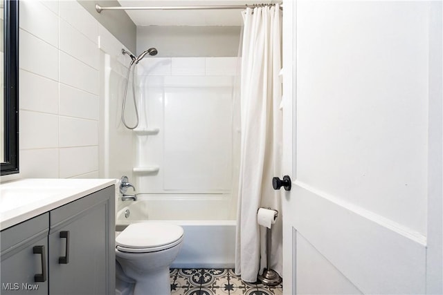 full bathroom featuring shower / bath combination with curtain, vanity, and toilet