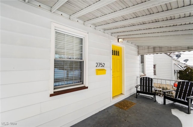 entrance to property with a porch