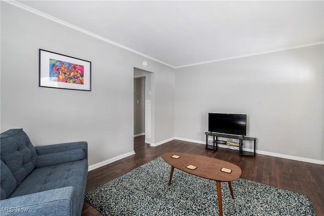 living room with ornamental molding and dark hardwood / wood-style flooring