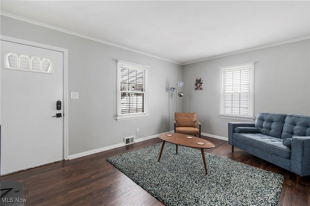 living room featuring dark hardwood / wood-style flooring and crown molding