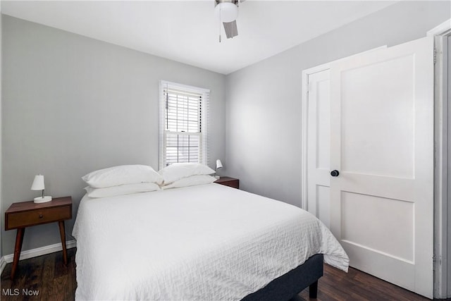 bedroom featuring ceiling fan and dark hardwood / wood-style floors