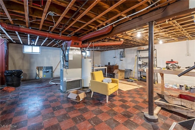 basement featuring heating unit and water heater