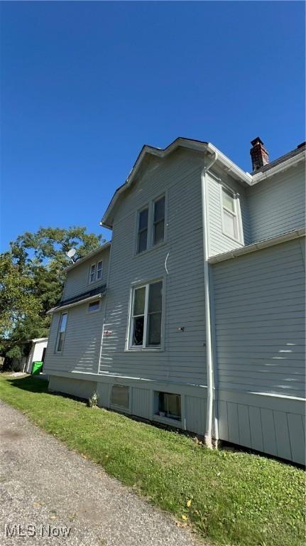 view of home's exterior featuring a yard