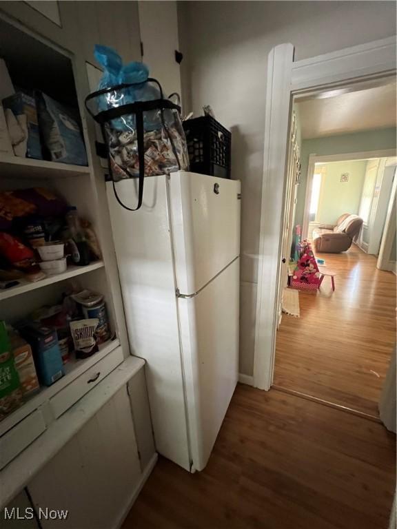 interior space featuring white fridge and hardwood / wood-style floors