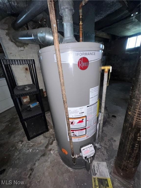 utility room featuring water heater